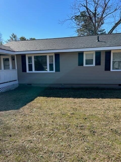 view of side of property with a yard