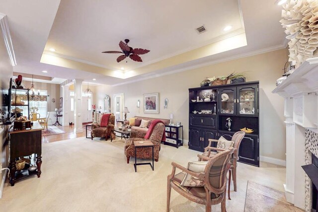 dining space featuring baseboards, ornamental molding, wood finished floors, an inviting chandelier, and a fireplace