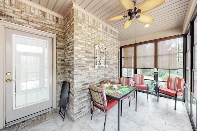 sunroom / solarium with ceiling fan
