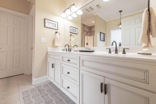 full bathroom featuring double vanity, visible vents, crown molding, and tile patterned floors