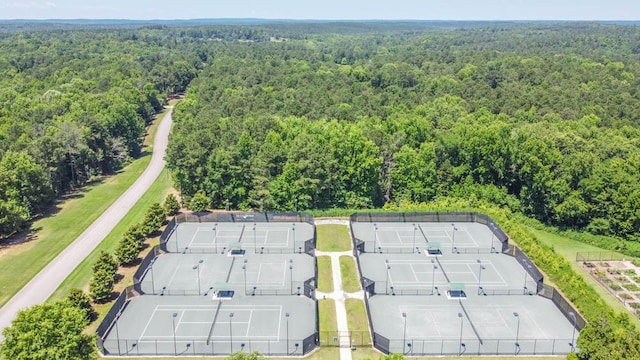 drone / aerial view featuring a forest view