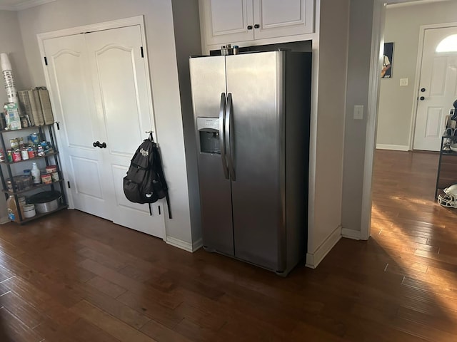 kitchen with baseboards, dark wood-style flooring, white cabinetry, and stainless steel refrigerator with ice dispenser