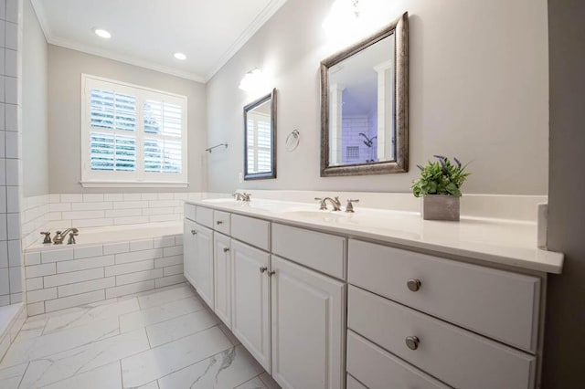 bathroom with vanity, a relaxing tiled tub, and crown molding