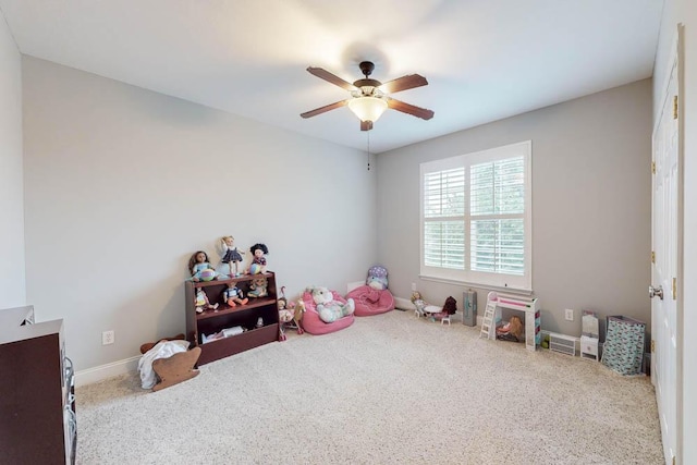 recreation room featuring carpet and ceiling fan