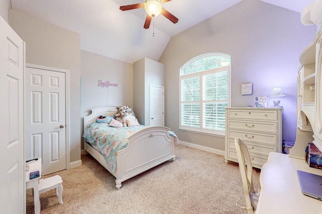 carpeted bedroom with ceiling fan and lofted ceiling