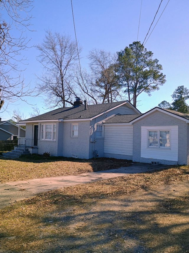 view of front of home featuring brick siding