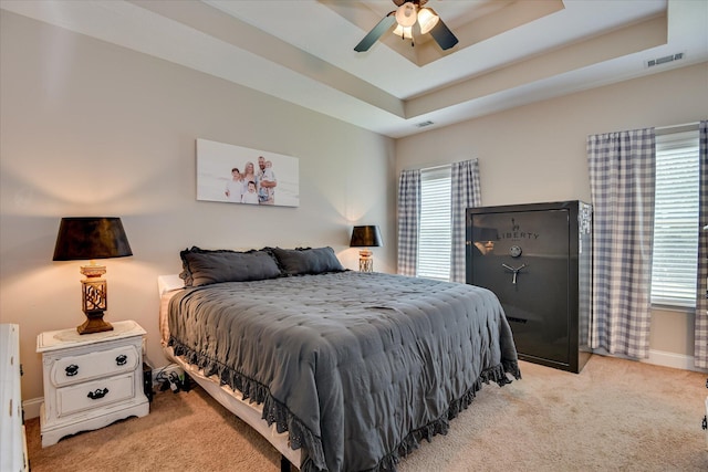 132 Running Creek Dr, North Augusta, SC 29860 - bedroom with multiple windows, light carpet, a tray ceiling, and a ceiling fan
