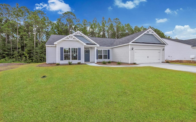 view of front of property featuring a front yard and a garage