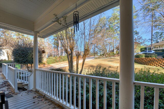 wooden terrace with a porch