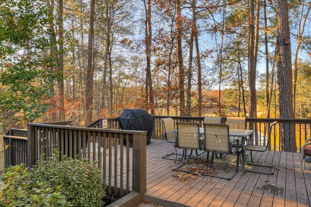 wooden terrace featuring a grill