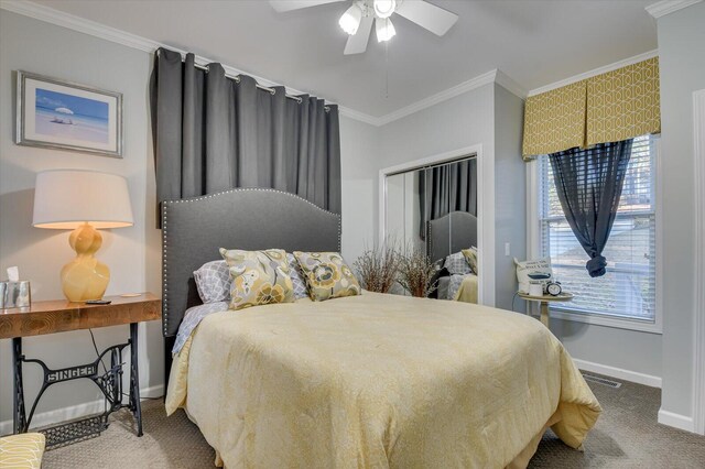 carpeted bedroom featuring ceiling fan and crown molding