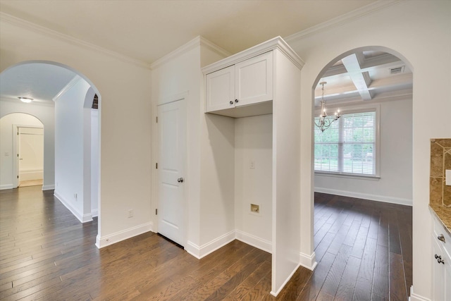 554 Bunchgrass St, Evans, GA 30809 - kitchen with ornamental molding, dark wood-type flooring, arched walkways, white cabinets, and a chandelier