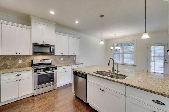 554 Bunchgrass St, Evans, GA 30809 - kitchen featuring stainless steel appliances, a sink, ornamental molding, a chandelier, and white cabinetry
