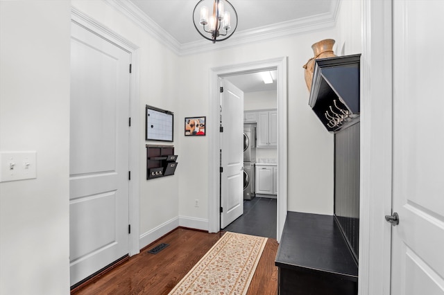 462 Armstrong Way, Evans, GA 30809 - hallway with dark wood-type flooring, crown molding, baseboards, stacked washer and clothes dryer, and a chandelier