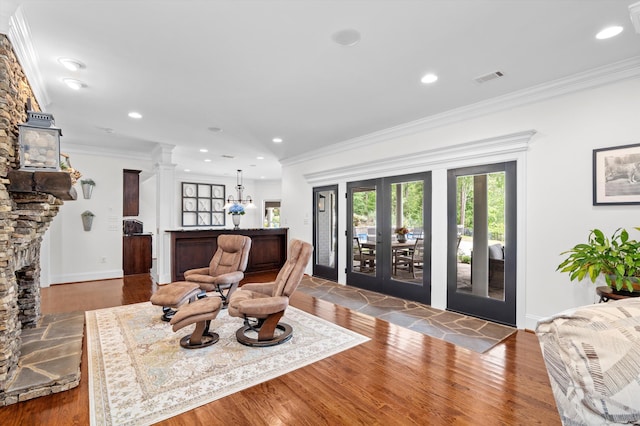 462 Armstrong Way, Evans, GA 30809 - living area with ornate columns, wood finished floors, recessed lighting, crown molding, and french doors