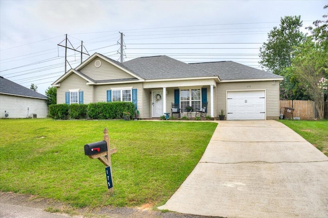 view of front of property featuring a porch, a front yard, and a garage