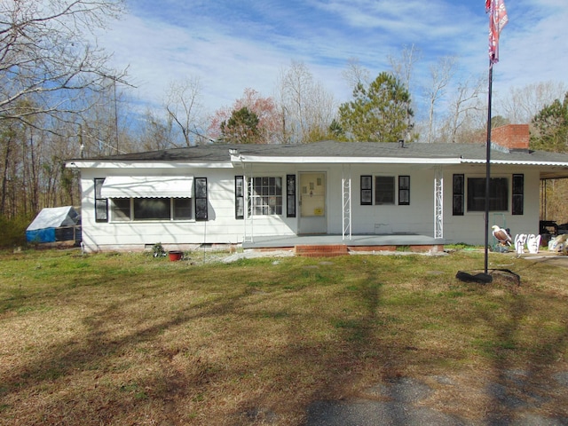 view of front of property with crawl space, a chimney, covered porch, and a front yard