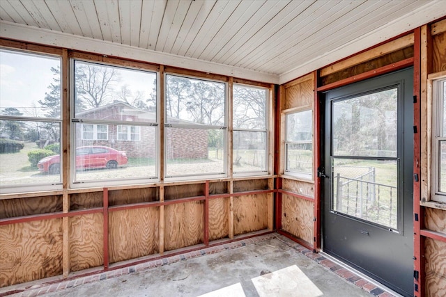 unfurnished sunroom featuring wooden ceiling