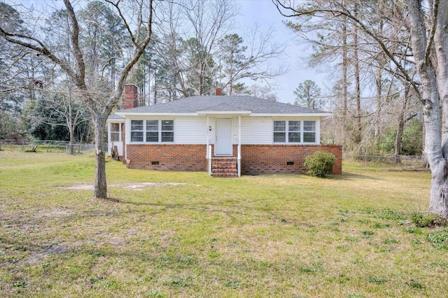 view of front of property with a front yard, fence, a chimney, and crawl space