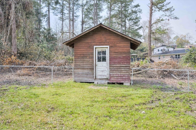 view of shed with a fenced backyard