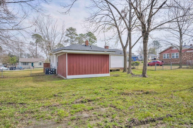 view of outbuilding featuring an outdoor structure and fence