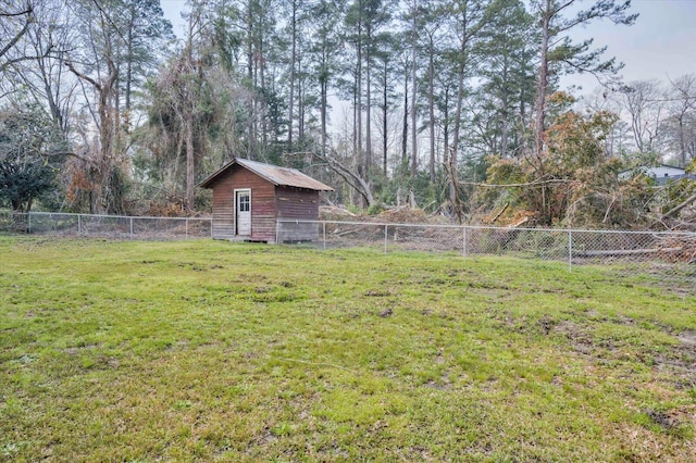 view of yard with an outbuilding and a fenced backyard