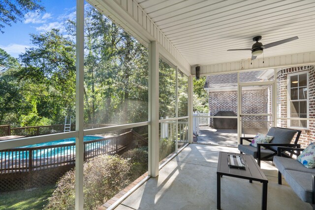 sunroom / solarium with ceiling fan