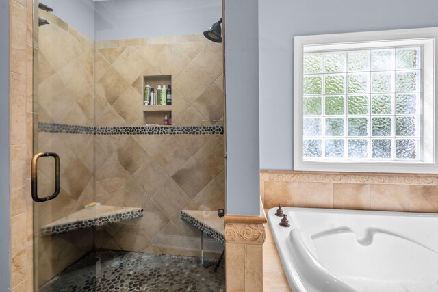 bathroom featuring plus walk in shower