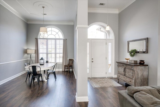 entrance foyer featuring visible vents, baseboards, dark wood-style flooring, and crown molding