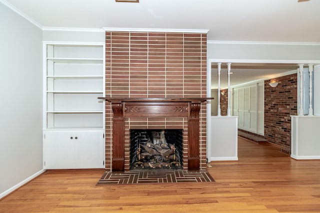 3134 Walton Way, Augusta, GA 30909 - unfurnished living room with wood finished floors, crown molding, a tiled fireplace, and baseboards