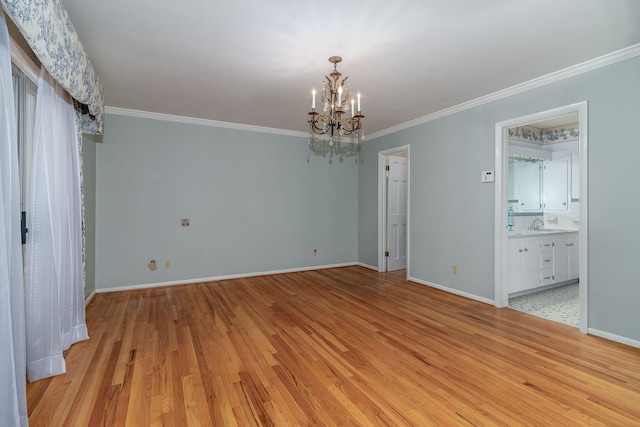 3134 Walton Way, Augusta, GA 30909 - unfurnished bedroom featuring light wood finished floors, a chandelier, crown molding, baseboards, and a sink