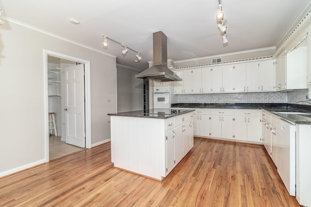 3134 Walton Way, Augusta, GA 30909 - kitchen featuring island range hood, white appliances, track lighting, dark countertops, and crown molding