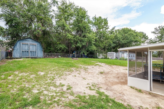 4375 Sandy Ridge Pl, Augusta, GA 30909 - fenced backyard with a storage shed, a playground, and view of wooded area