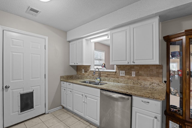 4375 Sandy Ridge Pl, Augusta, GA 30909 - kitchen with dishwasher, tasteful backsplash, white cabinets, light tile patterned floors, and a textured ceiling