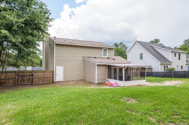 4375 Sandy Ridge Pl, Augusta, GA 30909 - rear view of property with a sunroom, a chimney, and a fenced backyard