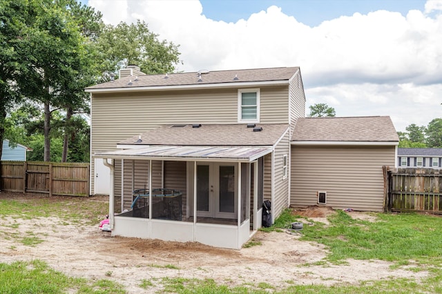 4375 Sandy Ridge Pl, Augusta, GA 30909 - rear view of property featuring a sunroom, a chimney, a fenced backyard, and a shingled roof