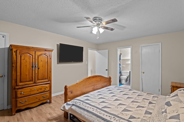 4375 Sandy Ridge Pl, Augusta, GA 30909 - bedroom with light wood-type flooring, a textured ceiling, connected bathroom, and a ceiling fan