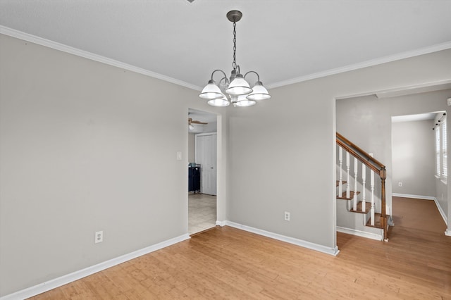4375 Sandy Ridge Pl, Augusta, GA 30909 - spare room with crown molding, stairway, a chandelier, light wood-style flooring, and a ceiling fan