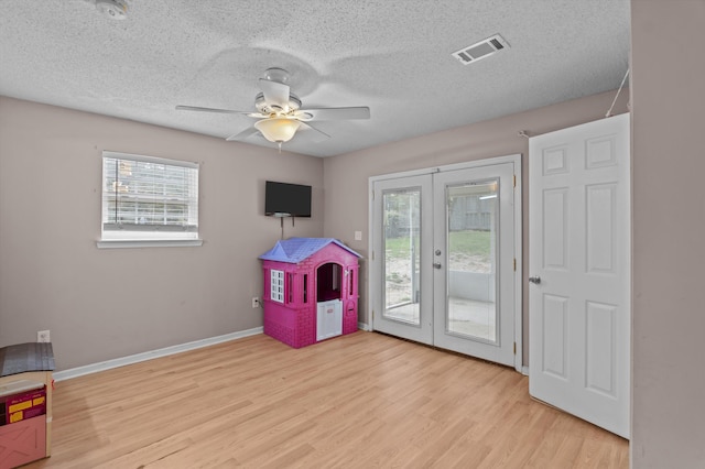 4375 Sandy Ridge Pl, Augusta, GA 30909 - recreation room featuring french doors, plenty of natural light, ceiling fan, wood finished floors, and a textured ceiling