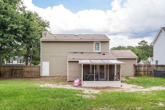 4375 Sandy Ridge Pl, Augusta, GA 30909 - back of property with a sunroom, a chimney, a shingled roof, and a fenced backyard