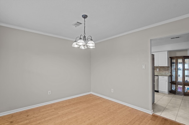 4375 Sandy Ridge Pl, Augusta, GA 30909 - empty room featuring crown molding, a chandelier, and light wood finished floors