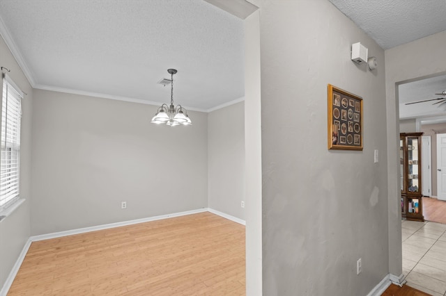 4375 Sandy Ridge Pl, Augusta, GA 30909 - unfurnished room with a textured ceiling, crown molding, wood finished floors, and a chandelier