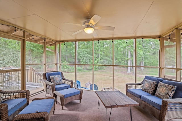 sunroom with plenty of natural light, ceiling fan, and an outdoor living space