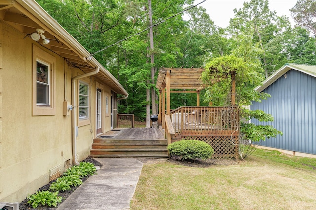 wooden terrace with a yard and a pergola