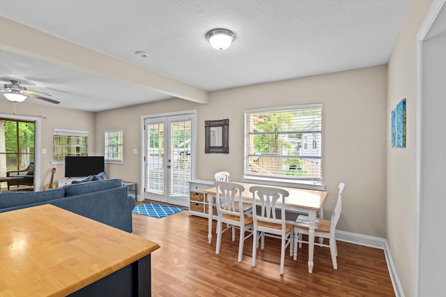 dining room featuring baseboards, a ceiling fan, french doors, and wood finished floors