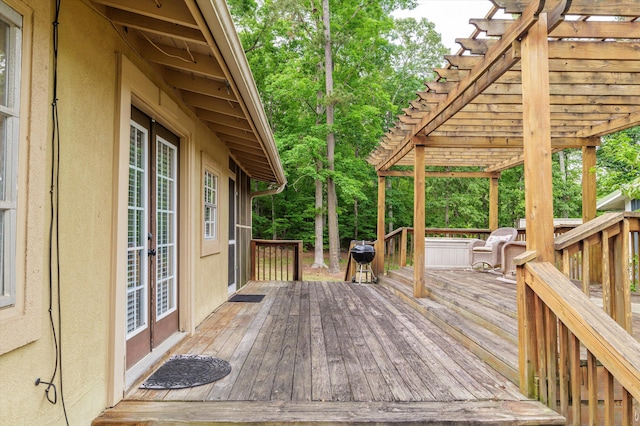 deck with french doors and a pergola