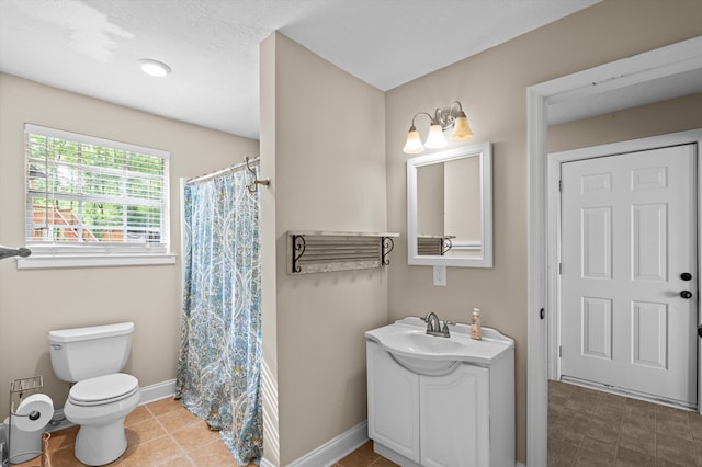 full bathroom with vanity, toilet, tile patterned floors, baseboards, and a shower with curtain