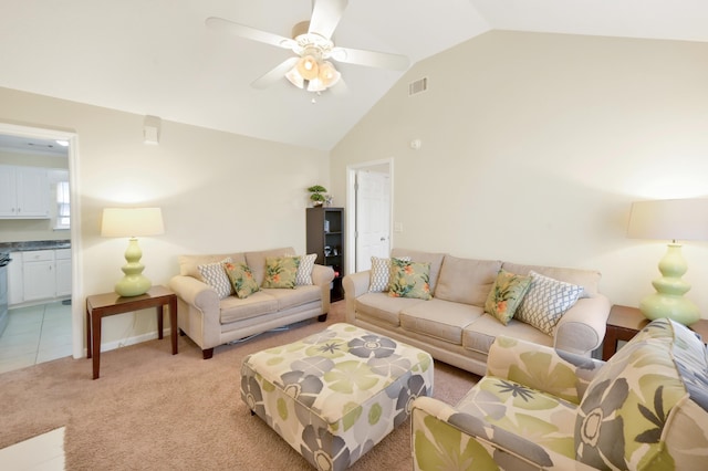 living room featuring light colored carpet, ceiling fan, and lofted ceiling