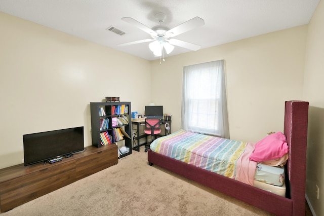 bedroom with dark colored carpet and ceiling fan