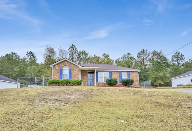 ranch-style home featuring a front yard